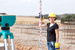 Foto: Construction worker on site at the measure Construction worker on site at the measure