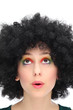 Young woman with afro looking up