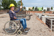 Foto: Engineer in a wheelchair on site Engineer in a wheelchair on site