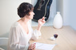 Attractive woman writing a letter and smoking
