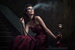 Beautiful woman in violet dress