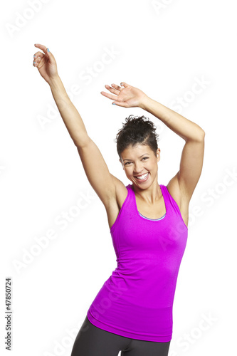 Photo: Young woman relaxing in sports outfit smiling Young woman relaxing in sports outfit smiling