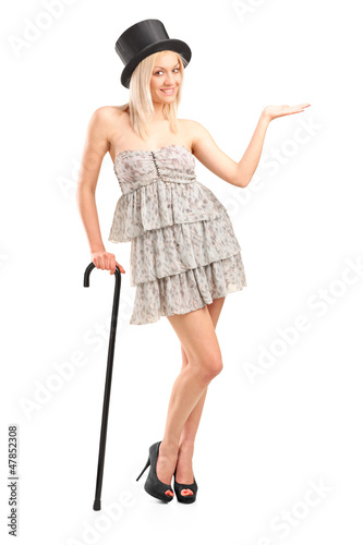 Photo: Blond woman holding cane and gesturing Blond woman holding cane and gesturing