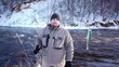 Man fishing trout in forest river