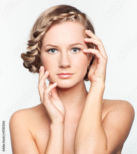 Photo: Portrait of young woman with braid hairdo Portrait of young woman with braid hairdo