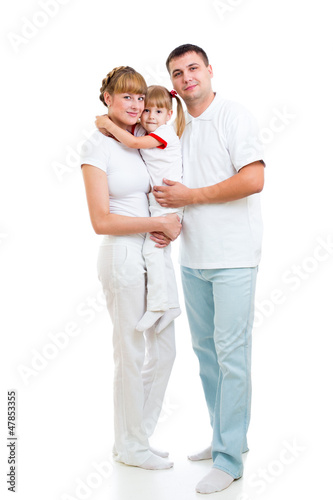 Photo: Happy young family isolated on white background Happy young family isolated on white background