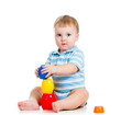 baby boy playing with toys, isolated over white