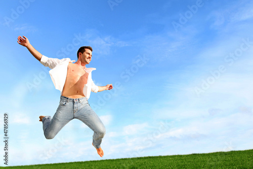 Photo: Man jumping in the air with joy Man jumping in the air with joy