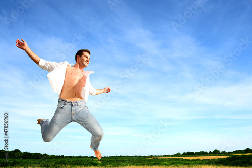 Photo: Man jumping in the air with joy Man jumping in the air with joy