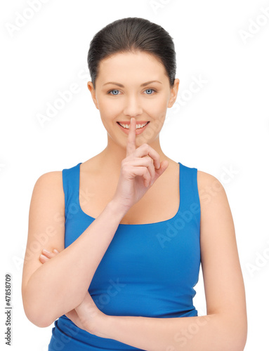 Photo: woman making a hush gesture woman making a hush gesture