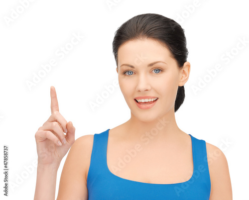 Photo: beautiful woman pointing her finger beautiful woman pointing her finger