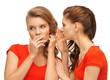 two talking teenage girls in red t-shirts