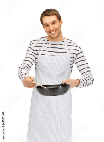 Photo: handsome man with pan and spoon handsome man with pan and spoon