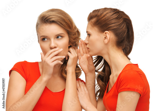 Photo: two talking teenage girls in red t-shirts two talking teenage girls in red t-shirts