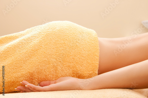 Photo: woman lying on massage table woman lying on massage table