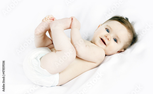 Photo: Portrait of a cute little baby on a white background Portrait of a cute little baby on a white background