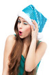 Foto: Woman in Christmas hat winking Woman in Christmas hat winking