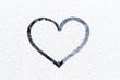 Photo: Heart drawn on frosty window. Heart drawn on frosty window.