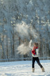 Foto: Young woman in a snowy furry hood Young woman in a snowy furry hood