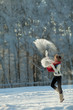 Foto: Young woman in a snowy furry hood Young woman in a snowy furry hood