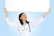 Young female doctor with a banner