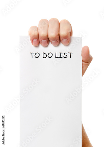 Photo: Hand was holding of a to do list paper note Hand was holding of a to do list paper note