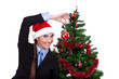 funny woman decorating christmas tree