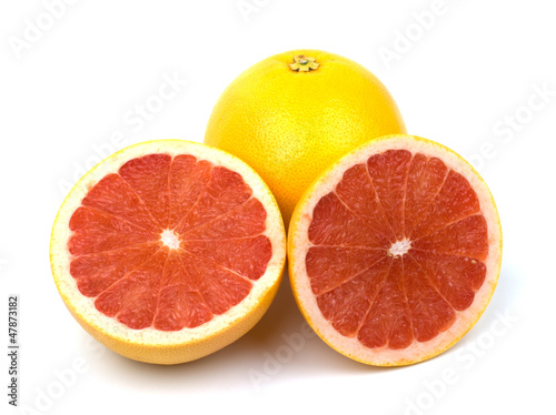 Photo: Cut grapefruit isolated on white background Cut grapefruit isolated on white background