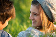 Attractive young girl smiling at boyfriend.