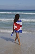 Girl walking in the natural beach