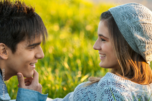 Photo: Young couple with in love face expression. Young couple with in love face expression.
