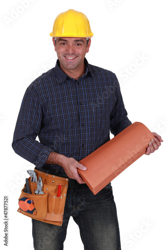 Photo: Smiling roofer standing on white background Smiling roofer standing on white background