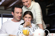 Family enjoying breakfast together
