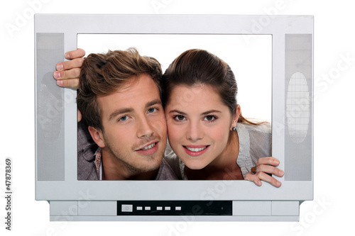 Photo: couple posing in a television frame couple posing in a television frame