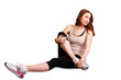 Photo: Exercising girl doing stretching exercise Exercising girl doing stretching exercise
