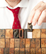 businessman hand building year 2013