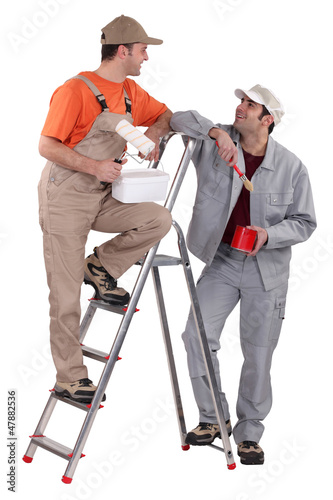 Photo: happy duo of male painters isolated on white happy duo of male painters isolated on white