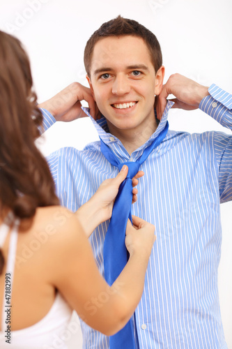 Photo: Businessman dressing at home in the morning Businessman dressing at home in the morning