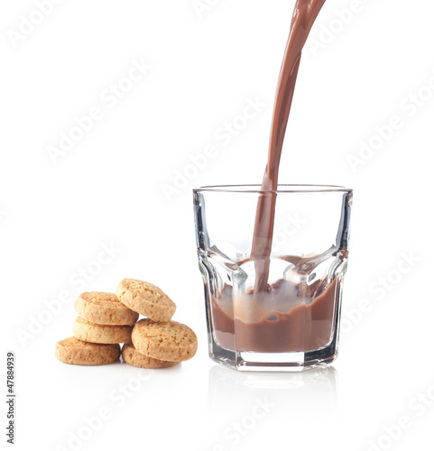 Photo: Chocolate splash in a glass with cookies Chocolate splash in a glass with cookies