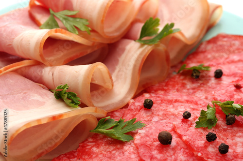 Photo: tasty bacon and sausage with spices, close up tasty bacon and sausage with spices, close up