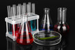 Test-tubes and green leaf tested in petri dish, isolated