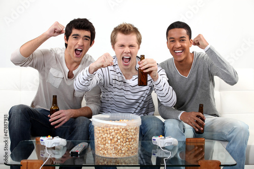 Photo: buddies watching football match on telly buddies watching football match on telly