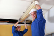 electricians installing neon