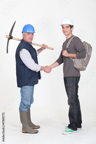 Photo: Experienced tradesman meeting his new apprentice Experienced tradesman meeting his new apprentice
