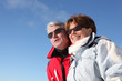 Retired couple in skiwear