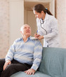  doctor talks with  senior  patient