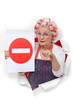 Elderly lady with hair rollers issuing warning