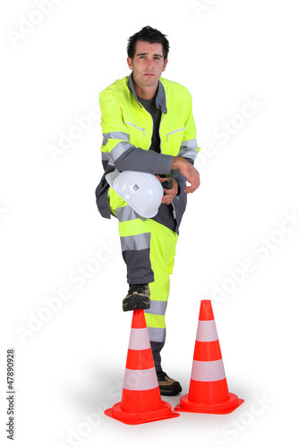 Photo: Traffic worker stood with cones Traffic worker stood with cones
