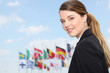 Businesswoman in front of flags