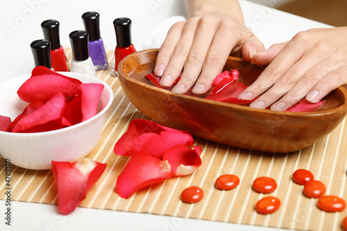 Photo: Woman is getting manicure Woman is getting manicure